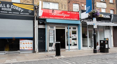 Exterior of Beautique Salon in London, England, GB showcasing the inviting storefront and vibrant signage.