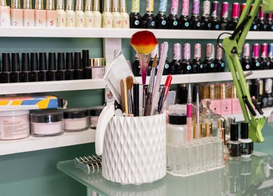 Nail polish and tools at Beautique Salon, London, England, GB. Vibrant display showcasing professional beauty products.