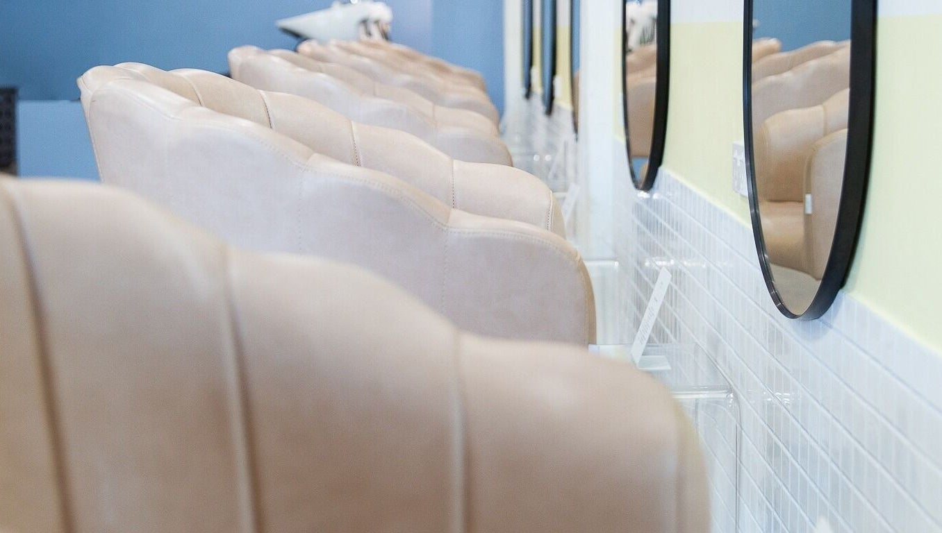 Elegant salon seating and mirrors at Bhãva Salon in Teneriffe, Queensland, AU.