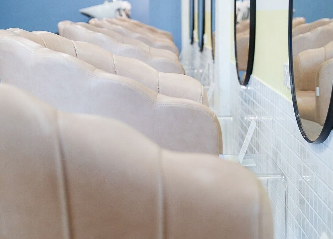 Elegant salon seating and mirrors at Bhãva Salon in Teneriffe, Queensland, AU.