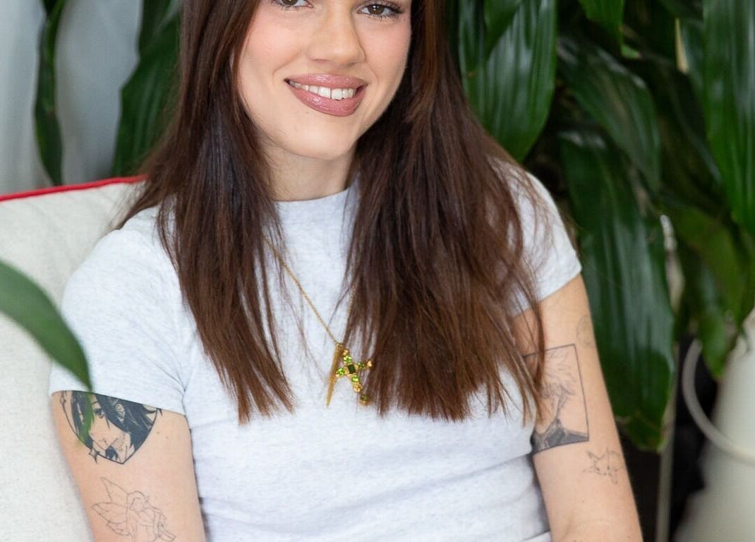 Client relaxing at Bhãva Salon, Teneriffe, Queensland, AU with lush plant backdrop.