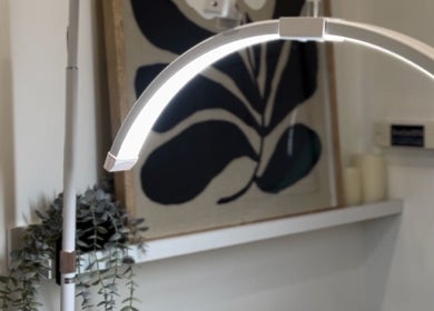 Modern lamp with greenery at Bouttell Beauty, North Lakes, Queensland, AU. Cozy and elegant ambience.