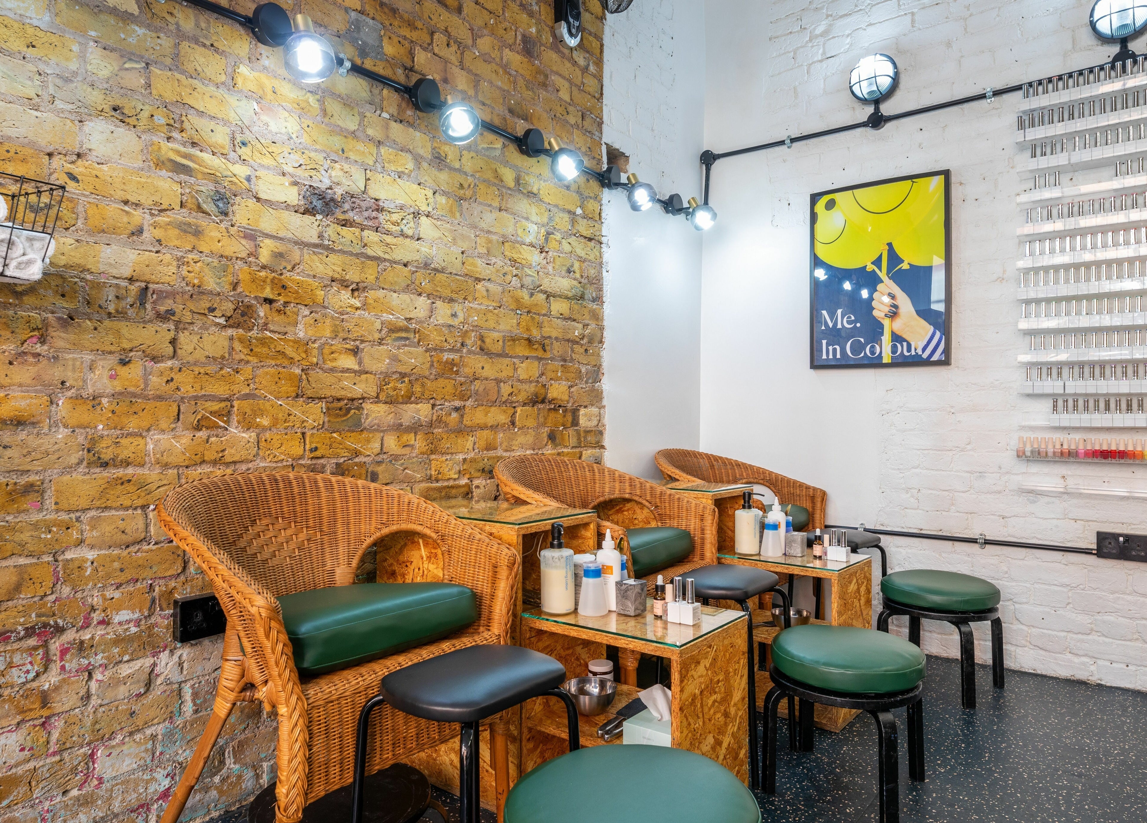 Shoreditch Nails Shoreditch, a cozy venue in London, England, GB, showcasing stylish wicker chairs and vibrant decor.