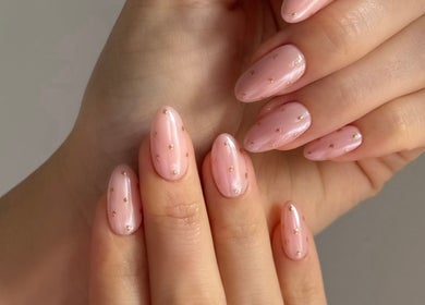 Elegant pink manicure with gold dots at Ace Nails & Beauty Redfern, Redfern, New South Wales, AU.
