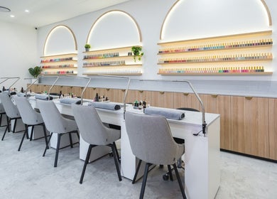 Modern manicure station at Ace Nails & Beauty Redfern, Redfern, New South Wales, AU elegantly lit with nail polish display.