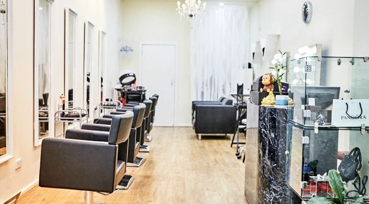 Modern interior of Madam Rouge Salon in Melbourne, Victoria, AU, featuring sleek styling chairs and decor.