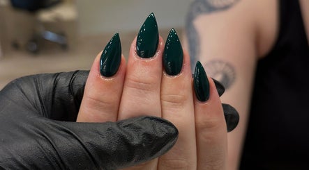 Sleek green stiletto nails at Beth Green Aesthetics, Manchester, England, GB.