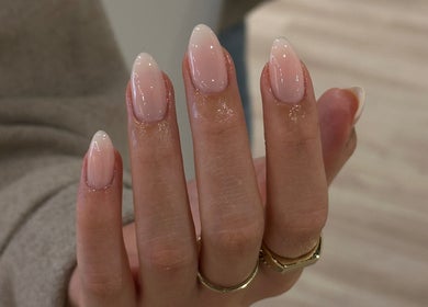 Elegant pink manicure at Beth Green Aesthetics in Manchester, England, GB showcasing glossy, well-groomed nails.