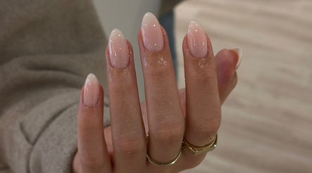Elegant pink manicure at Beth Green Aesthetics in Manchester, England, GB showcasing glossy, well-groomed nails.