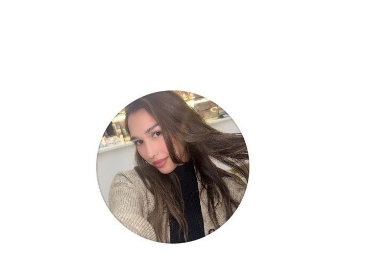 Stylish woman at Malayage in Nottingham, England, GB showcasing sleek hair and casual style.