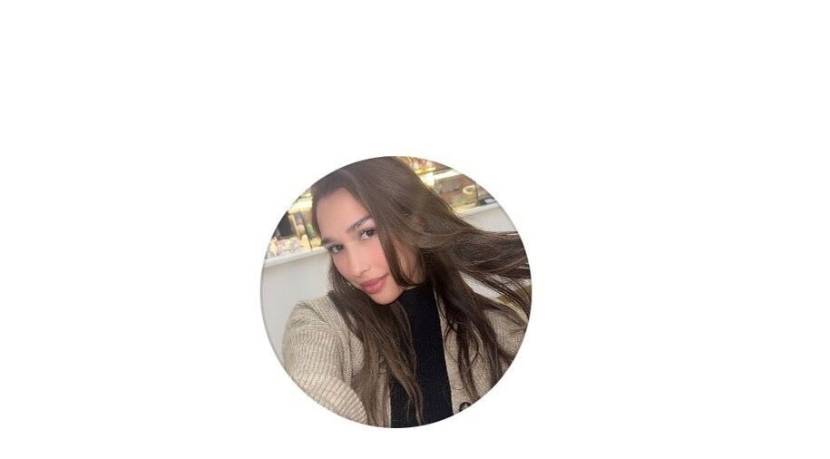 Stylish woman at Malayage in Nottingham, England, GB showcasing sleek hair and casual style.