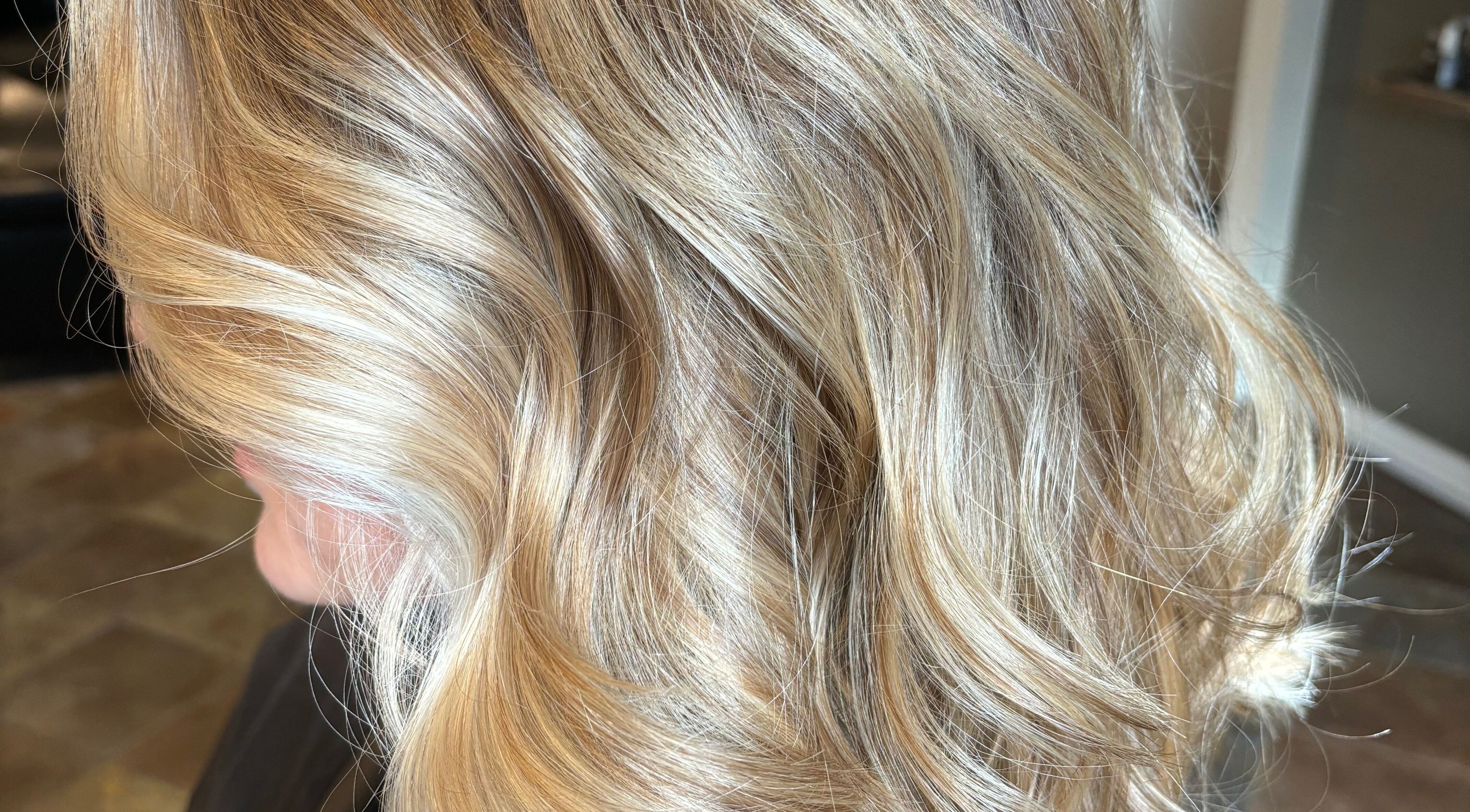 Gorgeous blonde hair waves at Narimane Kanaan, Ottawa, Ontario, CA, showcasing professional styling.