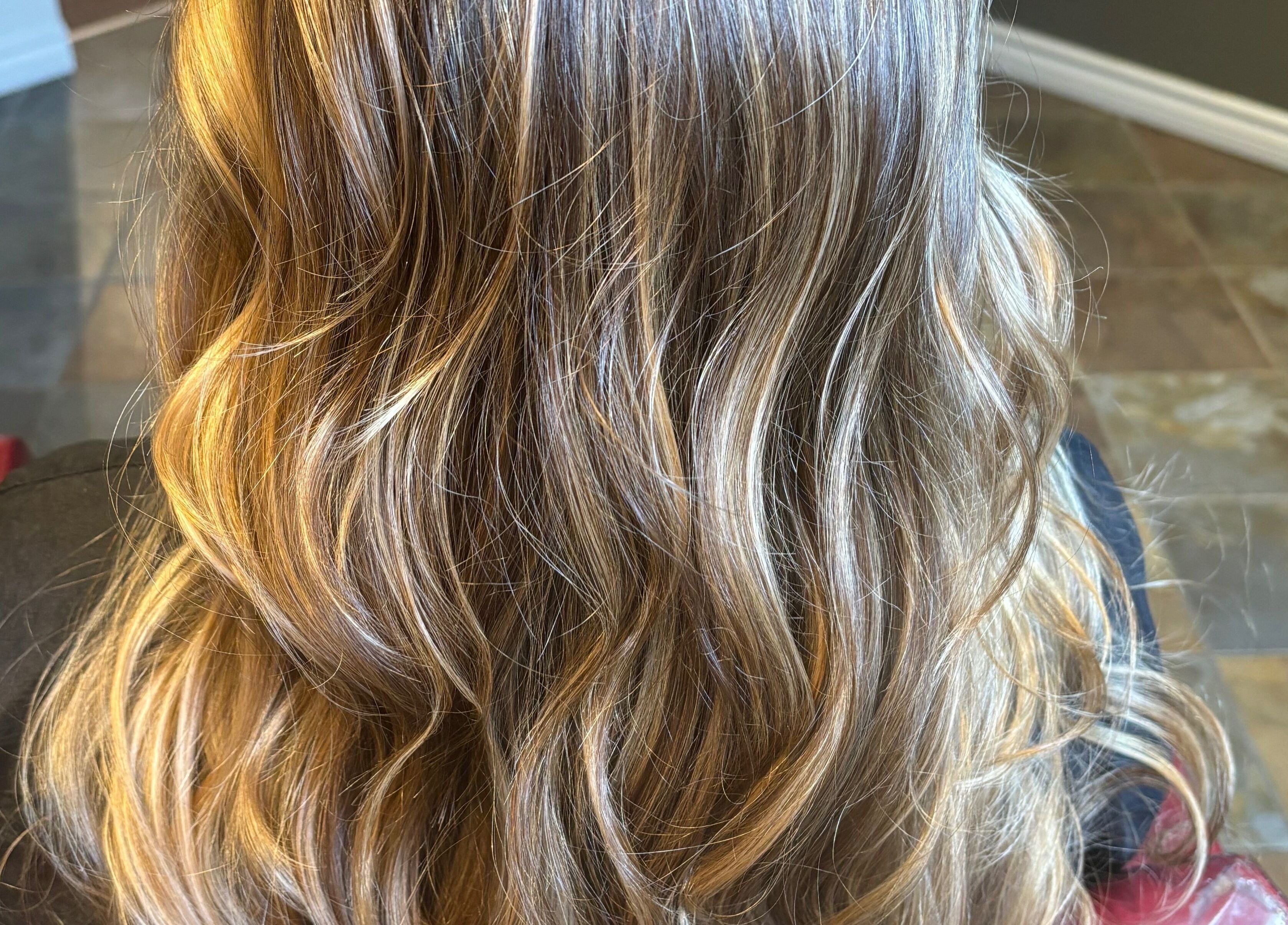 Beautifully styled wavy blonde hair at Narimane Kanaan, Ottawa, Ontario, CA.