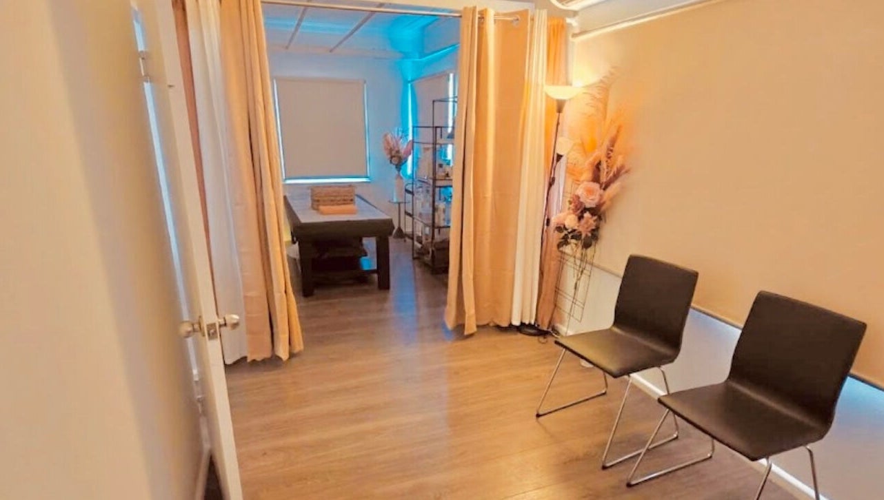 Tranquil room at Remotion remedial fusion therapy in Condell Park, New South Wales, AU, with massage table and chairs.