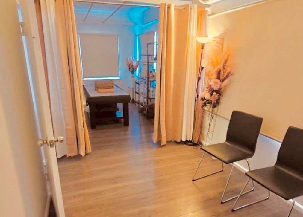 Tranquil room at Remotion remedial fusion therapy in Condell Park, New South Wales, AU, with massage table and chairs.