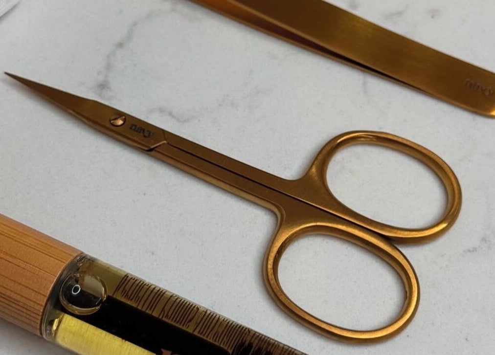 Luxury gold beauty tools at Sugar Cane Salon, London, England, GB, showcasing premium self-care elegance.