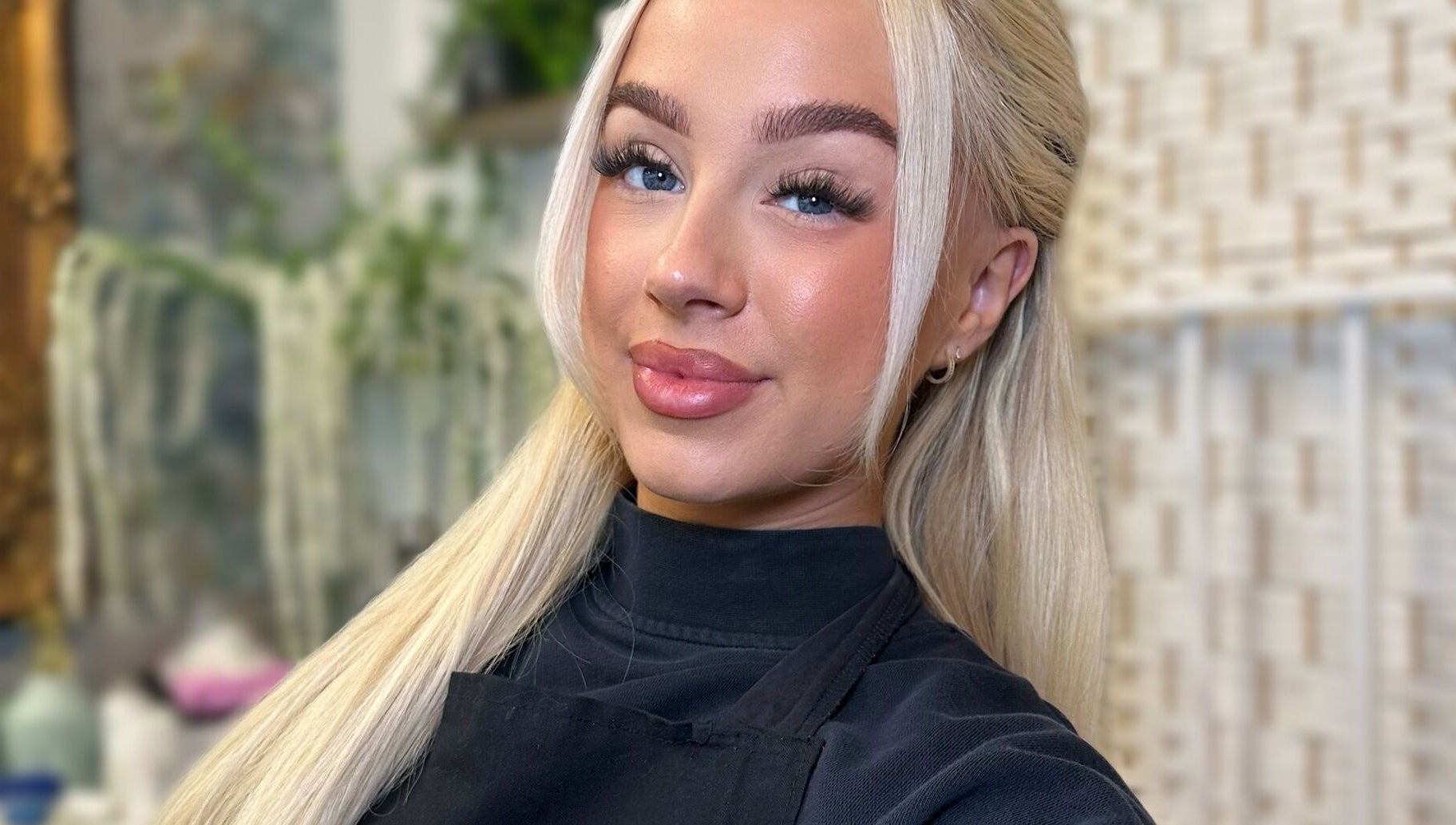 Experienced stylist at Braden Beauty in Uplands, Wales, GB, showcasing elegant beauty services.