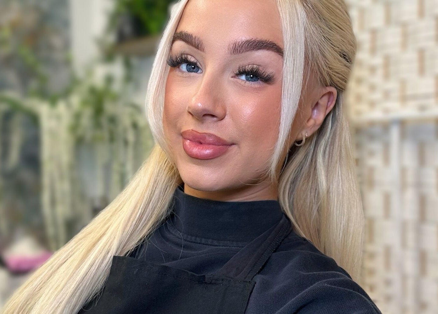 Experienced stylist at Braden Beauty in Uplands, Wales, GB, showcasing elegant beauty services.