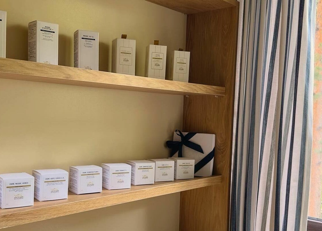 Apricot Spa's elegantly arranged skincare products on wooden shelves in Yerevan, Yerevan, AM.