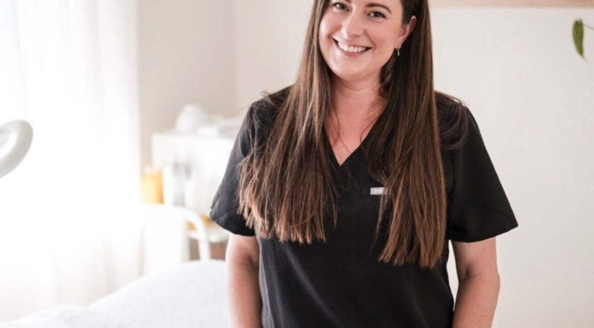 Smiling beauty professional at Justine Michele Beauty, Melbourne, Victoria, AU.