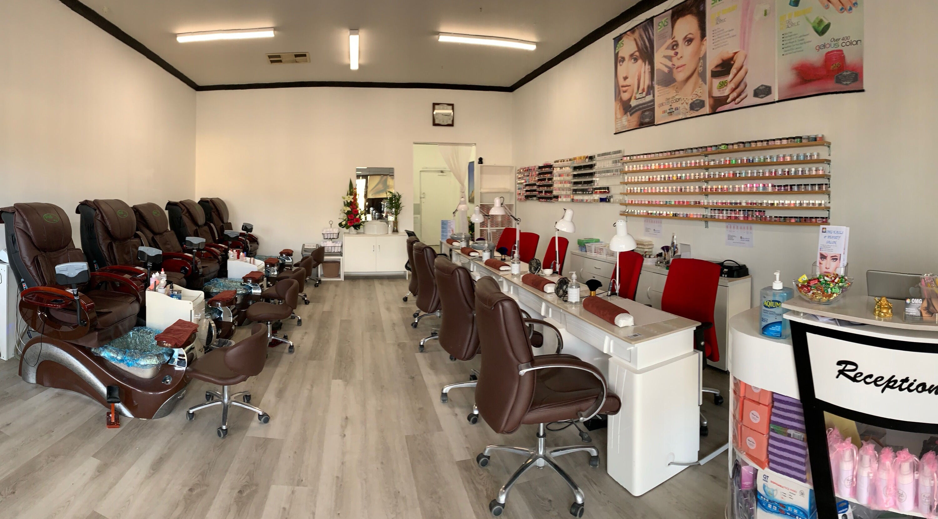 Interior view of Omg Nails and Beauty Salon in Melbourne, Victoria, AU, showcasing elegant pedicure and manicure stations.