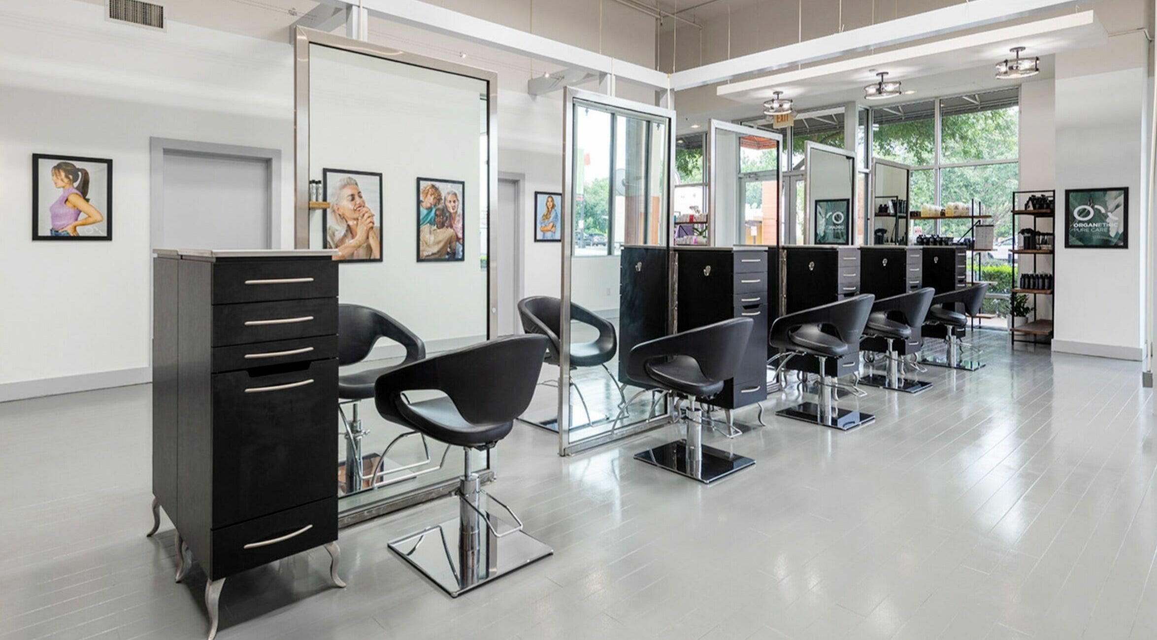 Modern interior of Smooshine Hair Salon in Austin, Texas, US with sleek styling chairs and vibrant decor.