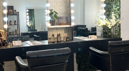 Elegant beauty station at Megy’s Hair Studio in London, England, GB with mirrors and stylish seating.