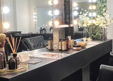 Elegant styling area at Megy’s Hair Studio in London, England, GB with chic decor and vibrant lighting.