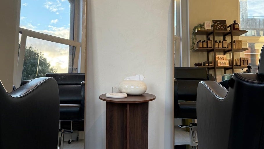 Modern interior seating at Megy’s Hair Studio, London, England, GB, with stylish decor and natural light.