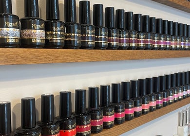 Colorful nail polish display at Nails From Natalie, Honiton, England, GB.