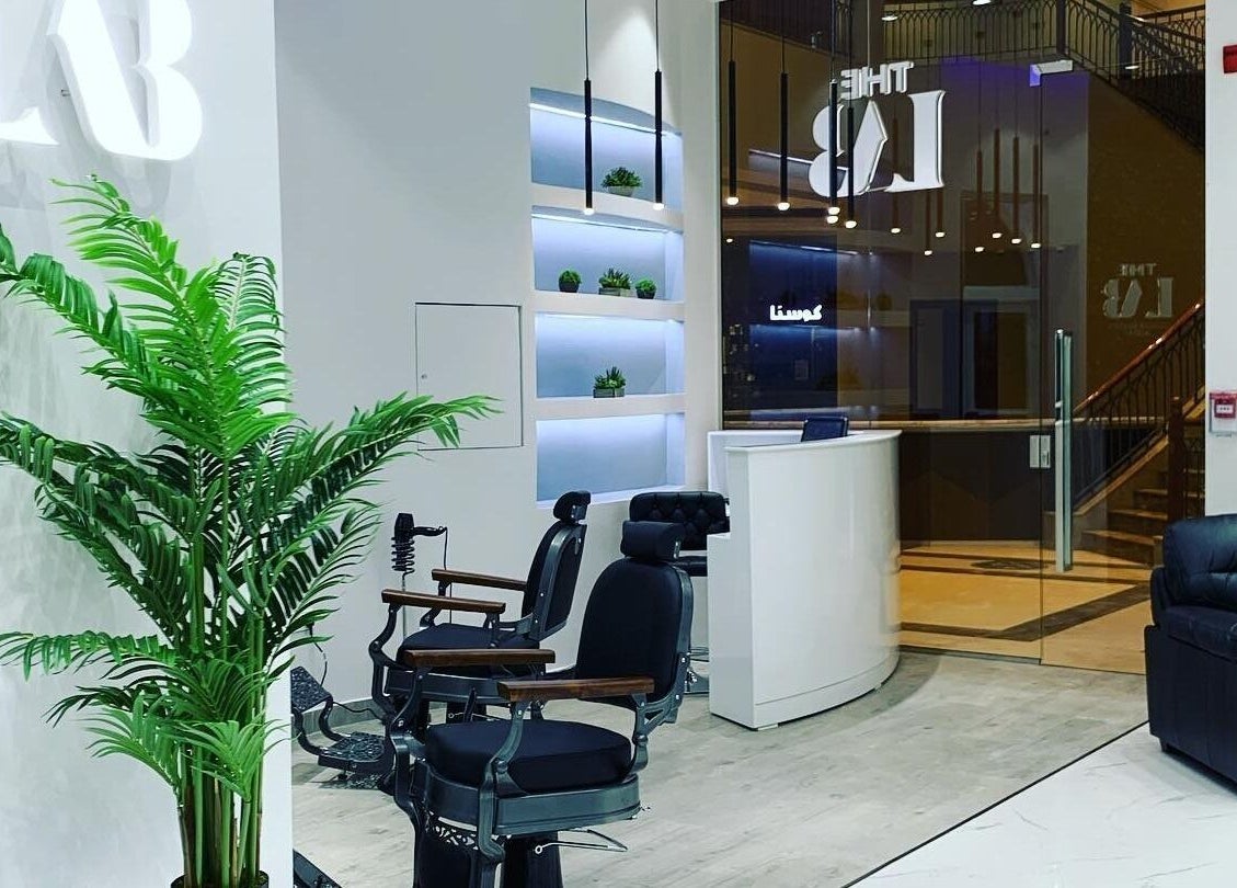 Chic interior of The Lab Gent's Salon & Spa - Arabian Ranches 2 in Dubai, AE, featuring stylish black chairs and decor.