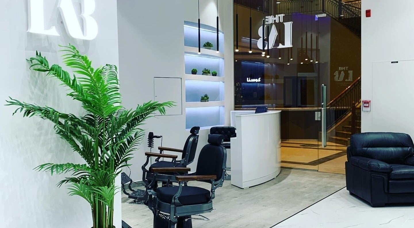Chic interior of The Lab Gent's Salon & Spa - Arabian Ranches 2 in Dubai, AE, featuring stylish black chairs and decor.