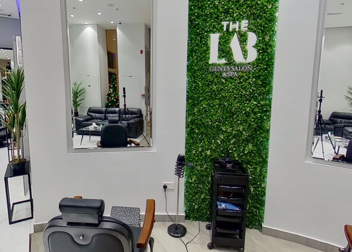 The Lab Gent's Salon & Spa - Arabian Ranches 2, Dubai, AE, featuring a stylish interior with lush greenery.