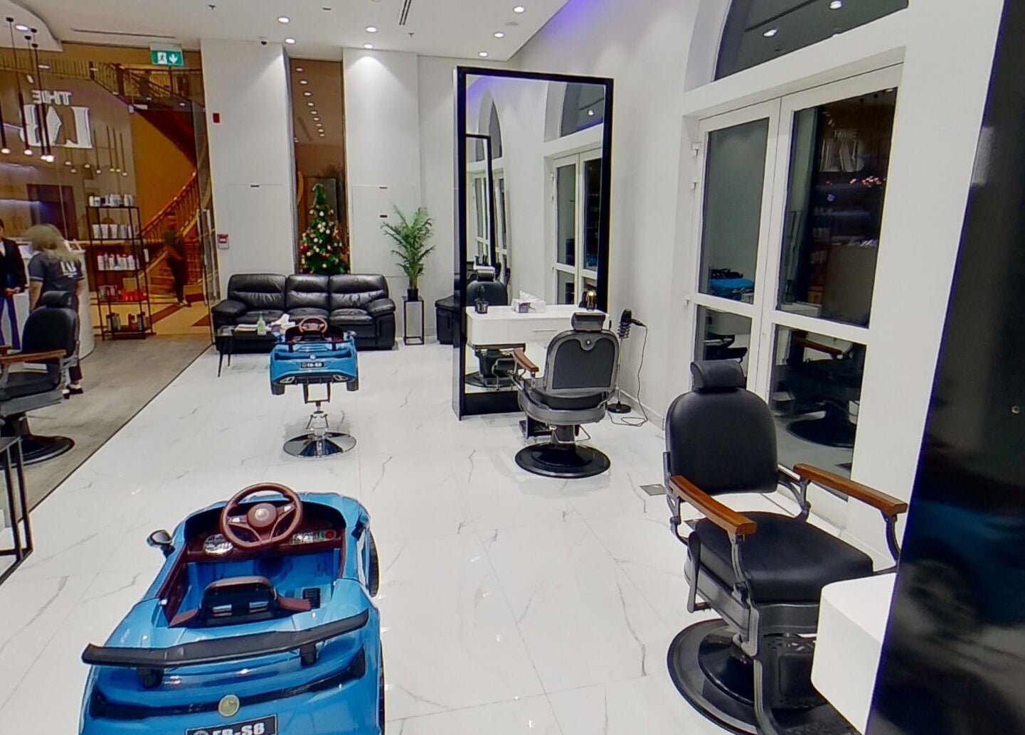 Sophisticated interior of The Lab Gent's Salon & Spa - Arabian Ranches 2, Dubai, AE with modern styling chairs.