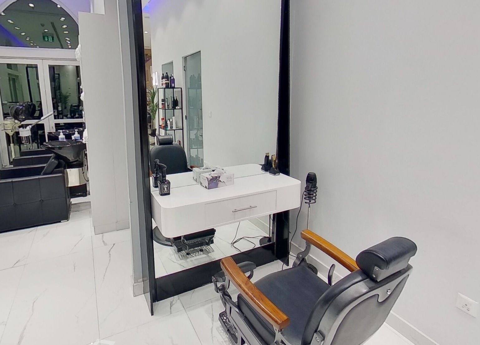 Chic interior of The Lab Gent's Salon & Spa - Arabian Ranches 2 in Dubai, AE, featuring a stylish barber chair.