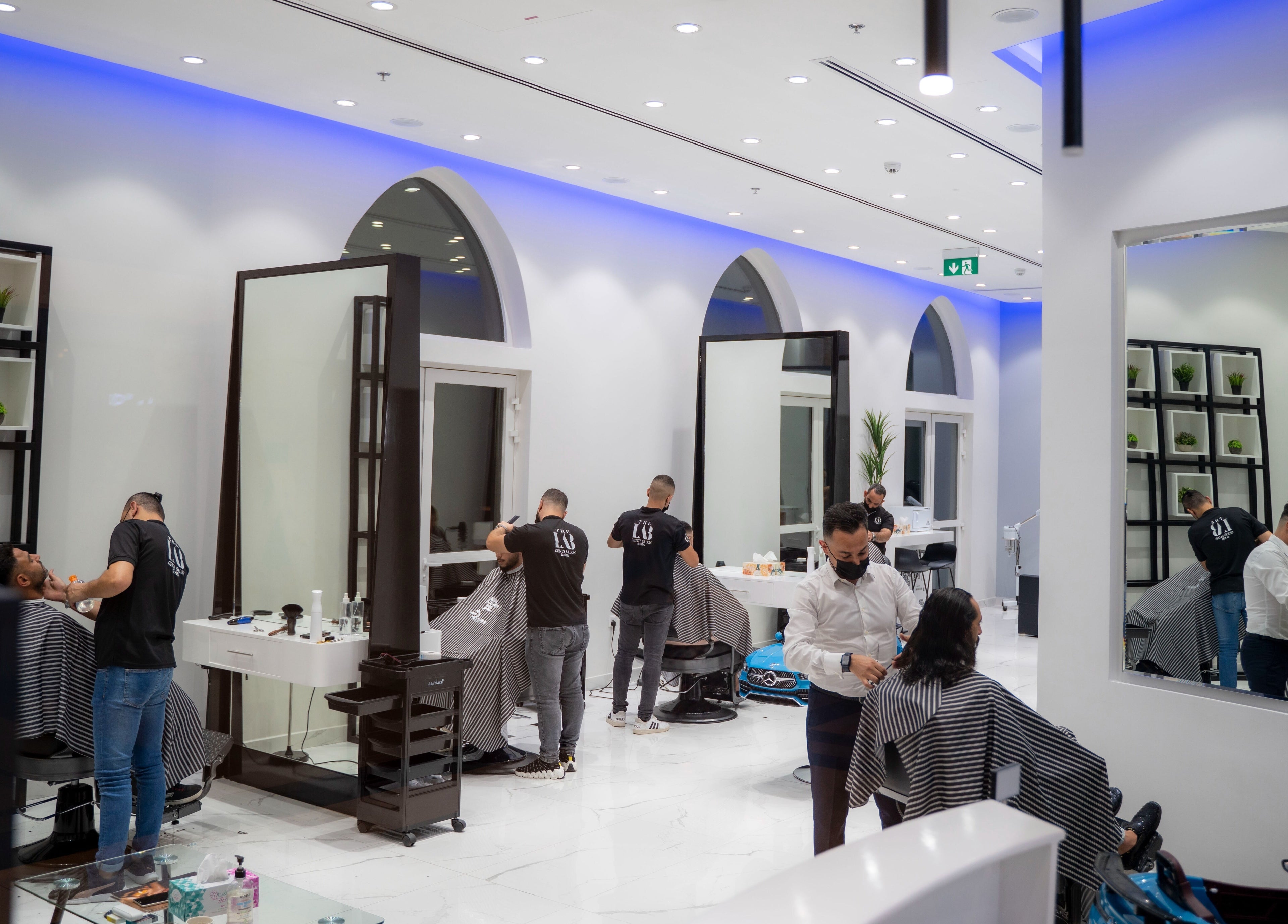 Elegant interior of The Lab Gent's Salon & Spa - Arabian Ranches 2 in Dubai, AE, featuring modern grooming stations.