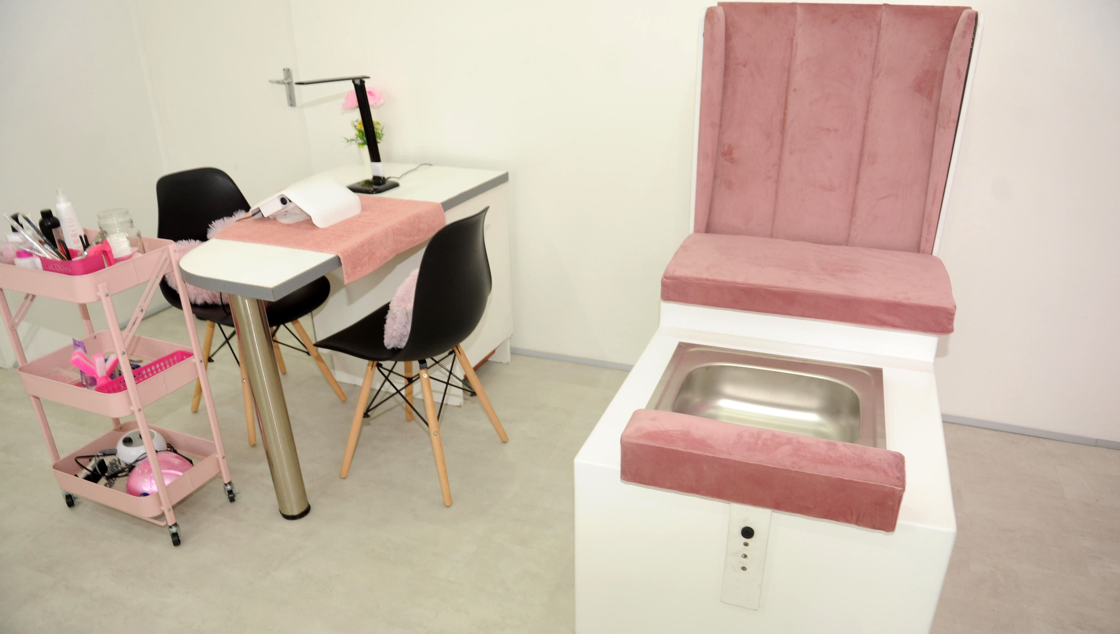 Chic nail salon interior at Clawed by the Miracle, Gqeberha, Eastern Cape, ZA. Features plush seating and modern design.