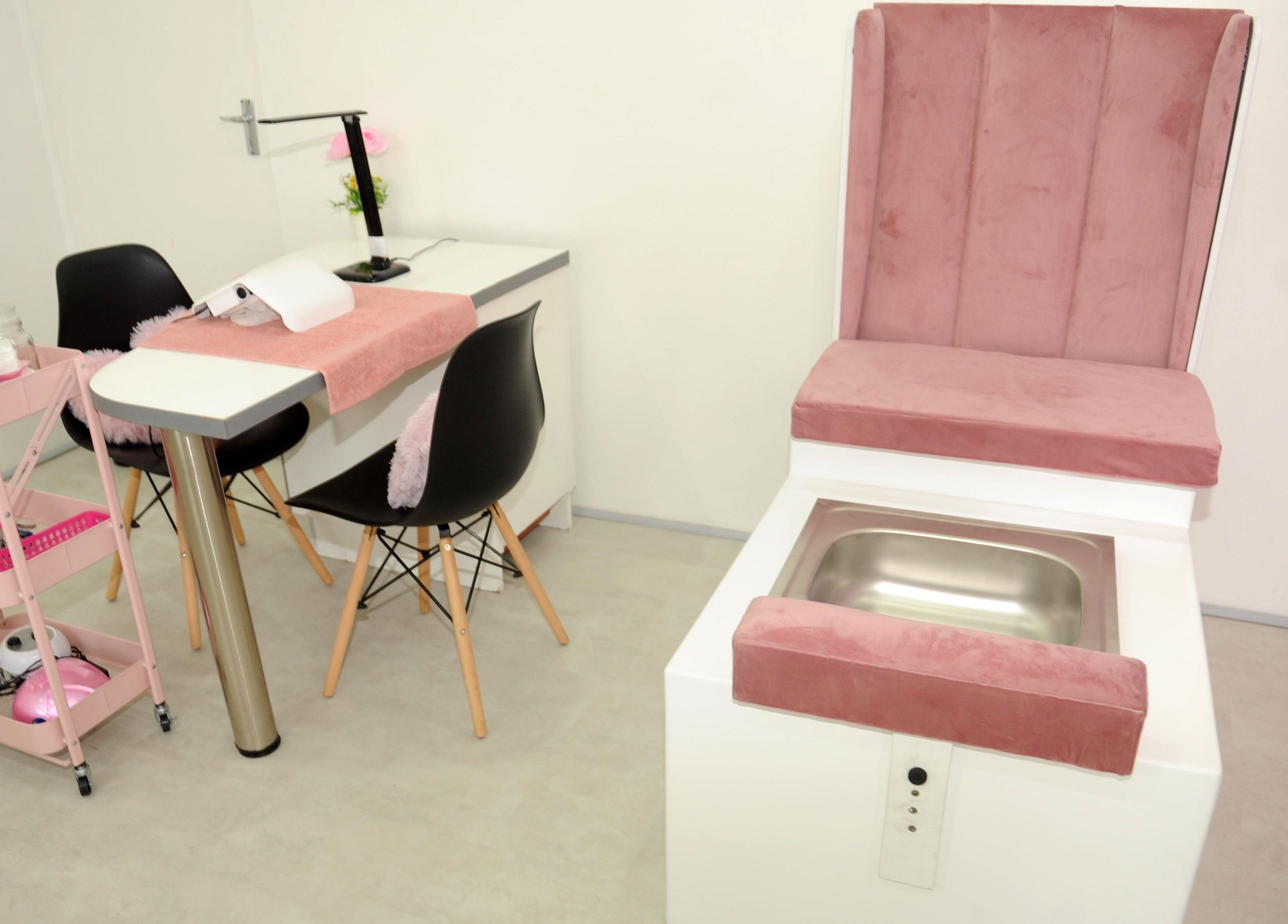 Chic nail salon interior at Clawed by the Miracle, Gqeberha, Eastern Cape, ZA. Features plush seating and modern design.