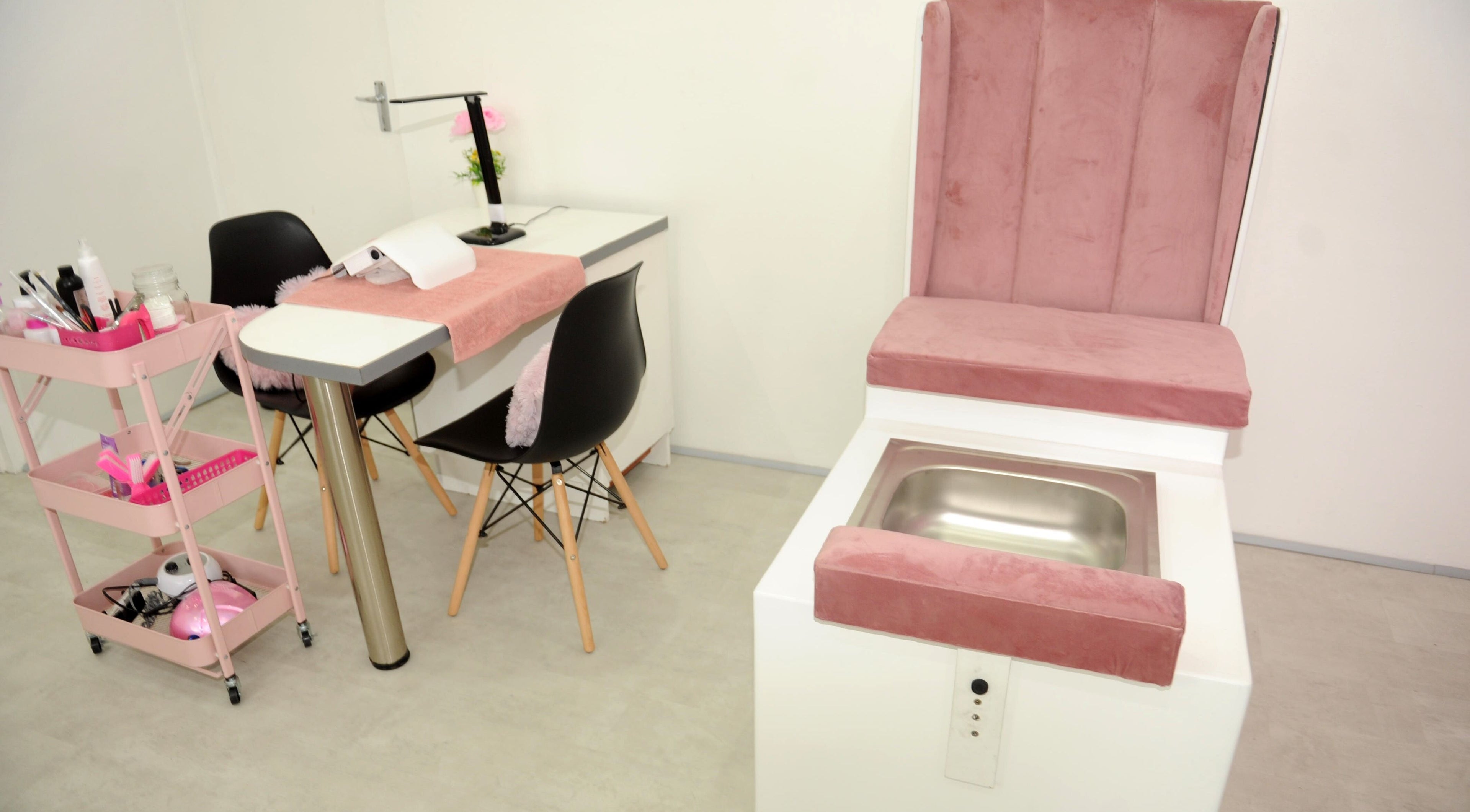 Chic nail salon interior at Clawed by the Miracle, Gqeberha, Eastern Cape, ZA. Features plush seating and modern design.