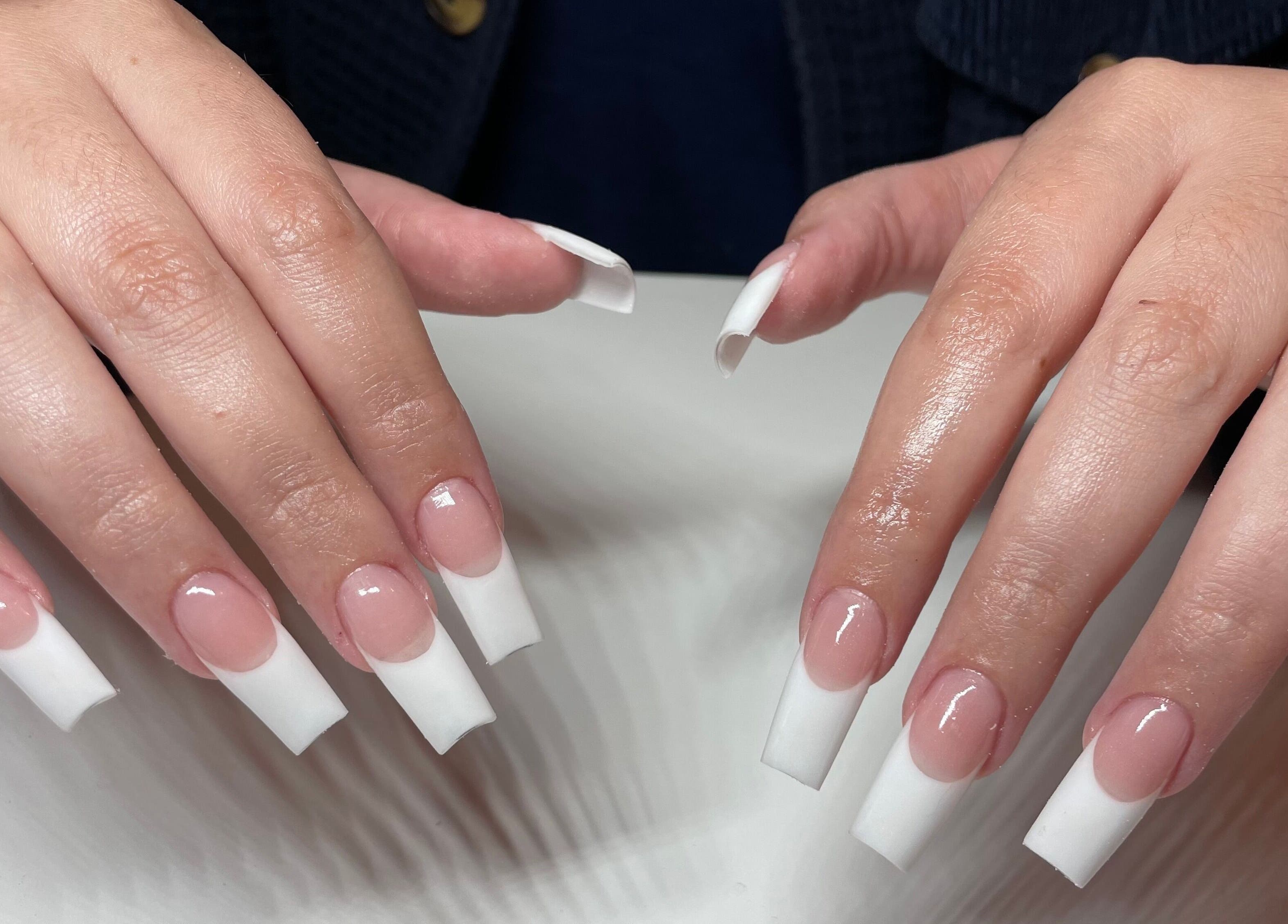 Stylish French manicure at Clawed by the Miracle, Gqeberha, Eastern Cape, ZA - elegant nail care excellence.