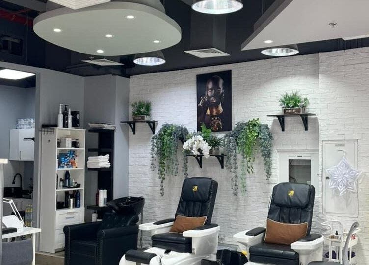 Modern interior of Diana's Lash House Ladies Salon in Dubai, AE featuring elegant pedicure chairs and lush decor.