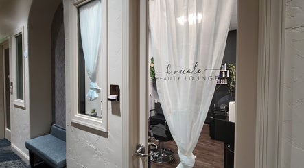 Entrance of K. Nicole Beauty Lounge in Deptford, New Jersey with stylish decor and open door.