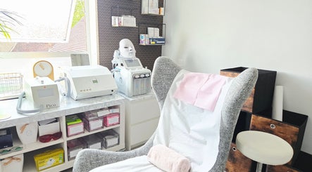 Relaxing treatment room at DERMEDICA Beauty Studio, Hertford, GB, featuring advanced skincare equipment.
