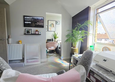 Relaxation room at DERMEDICA Beauty Studio, Hertford GB, with plush chair and bright window view.