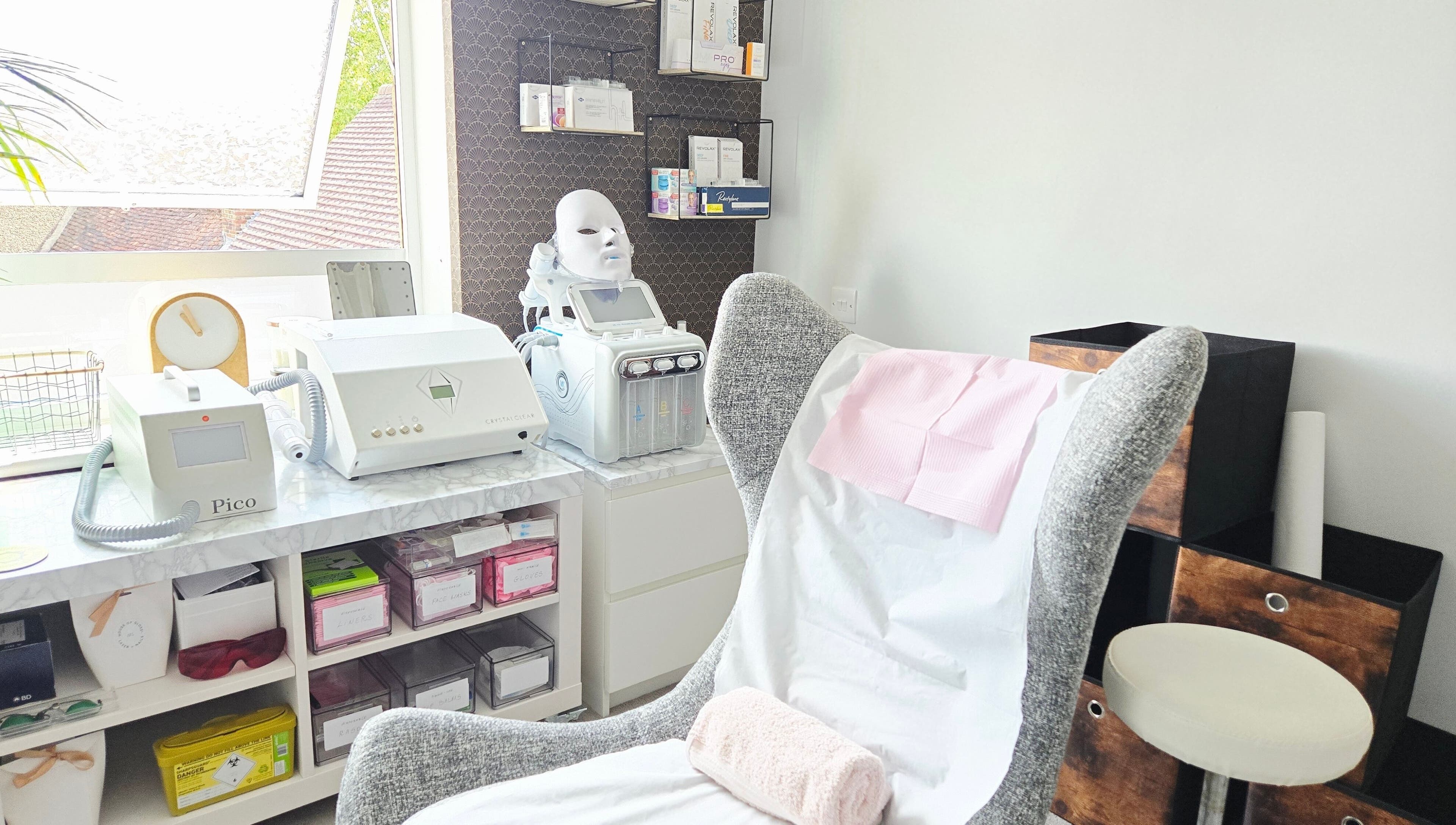 Bright, inviting treatment room at DERMEDICA Beauty Studio, Hertford, GB, featuring modern skincare equipment.