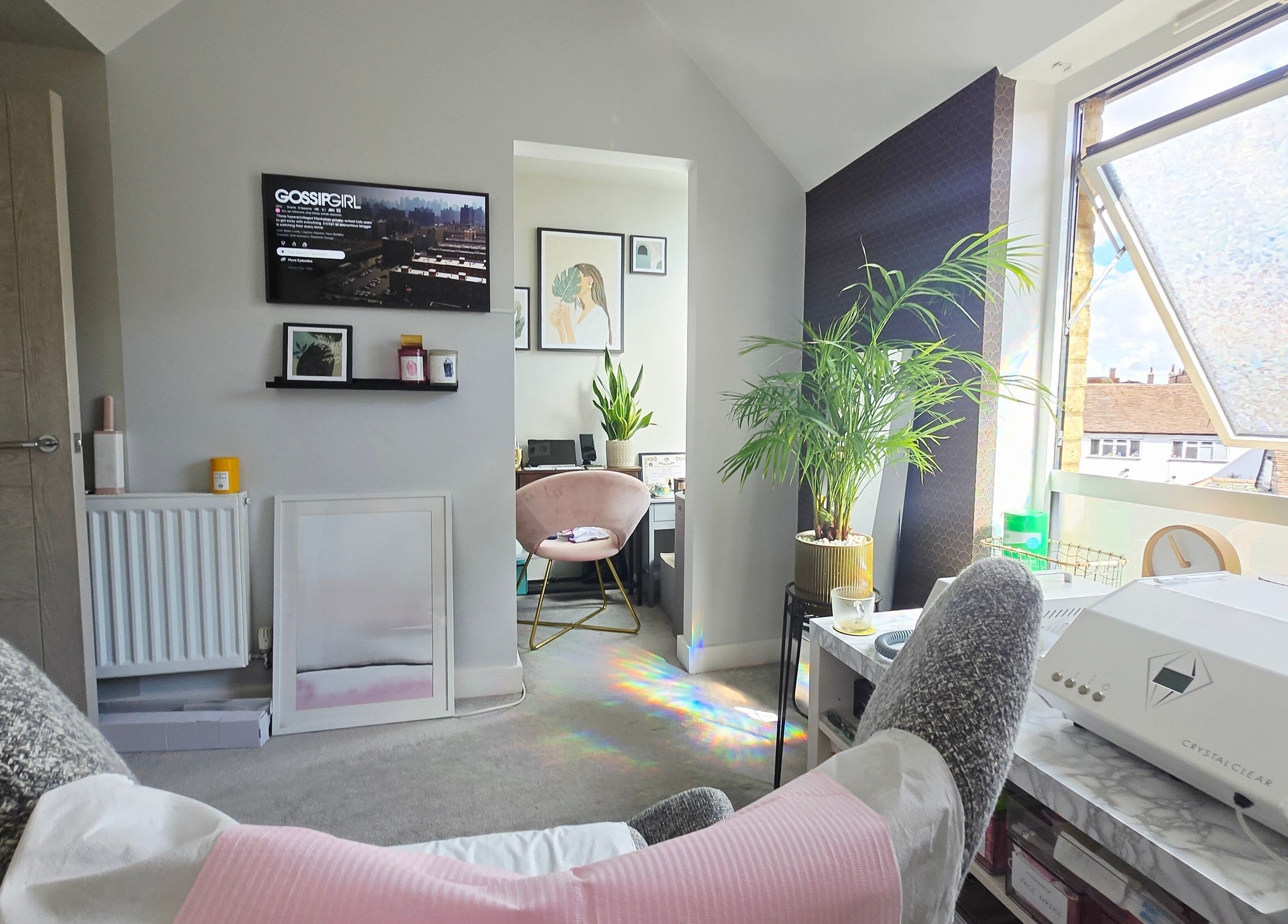 Bright, cozy treatment room at DERMEDICA Beauty Studio in Hertford, GB with plants and natural light.
