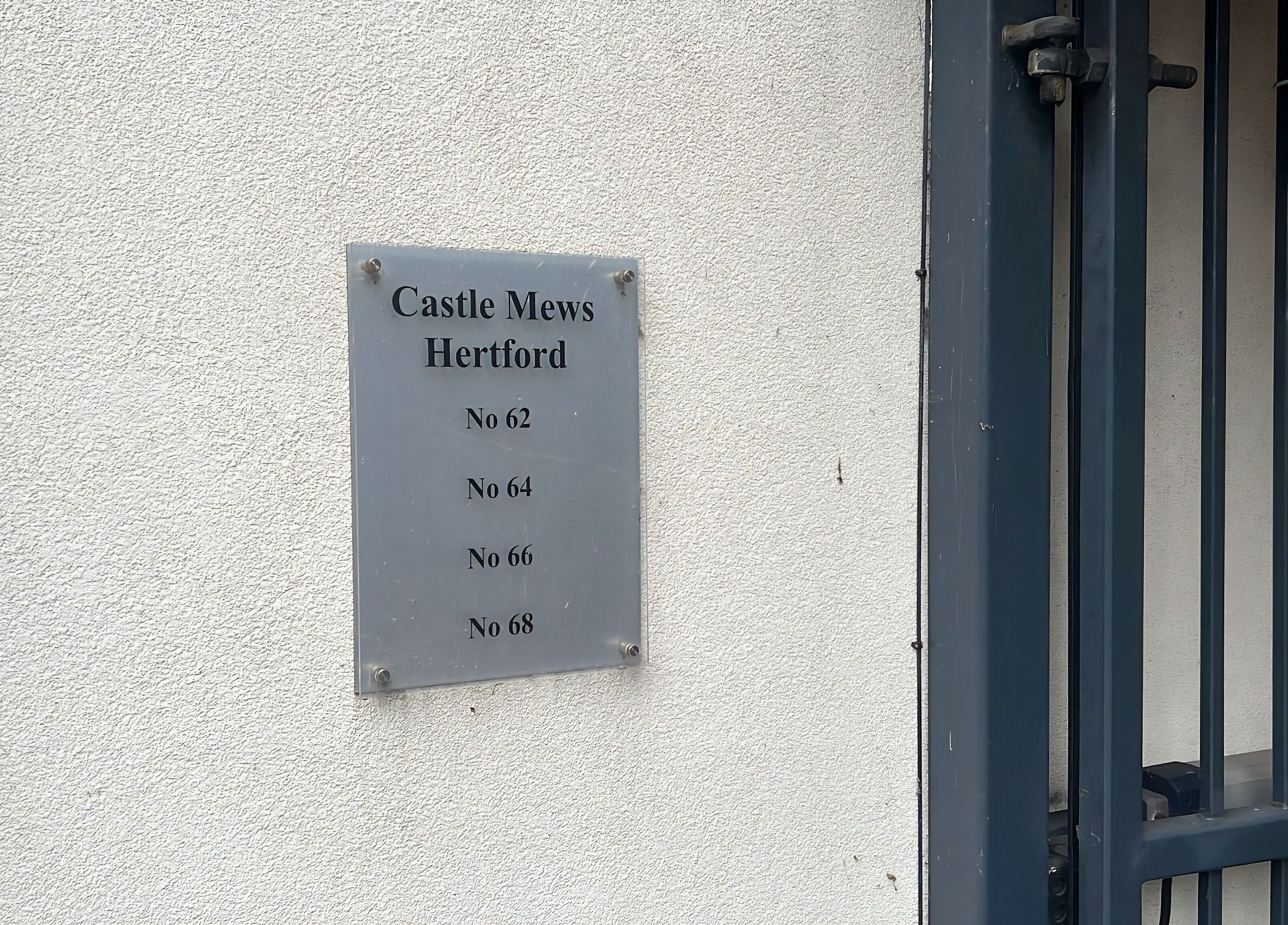 Entrance plaque for Castle Mews near DERMEDICA Beauty Studio in Hertford, GB.