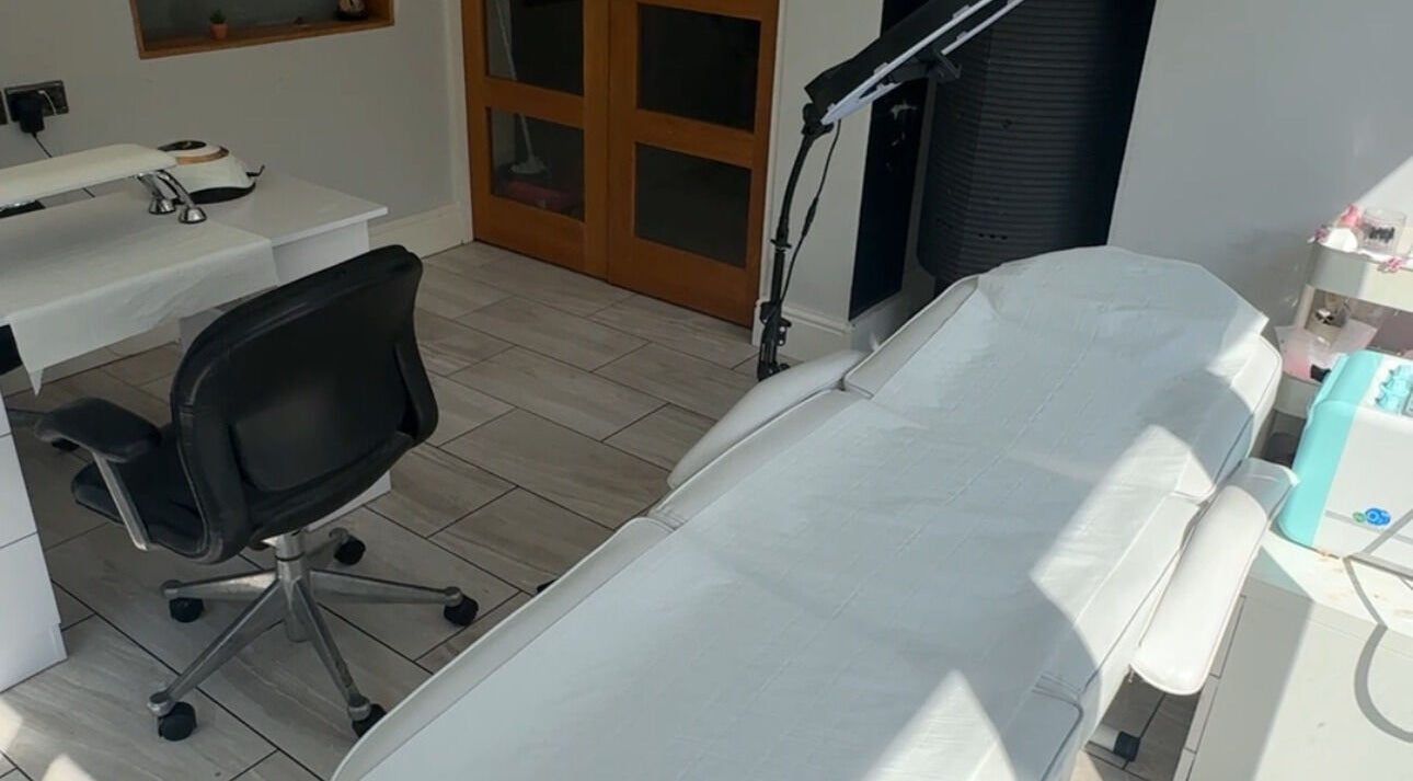 Treatment room at Tal Brea Beauty, Rochdale, England, GB, featuring a chair and treatment table.