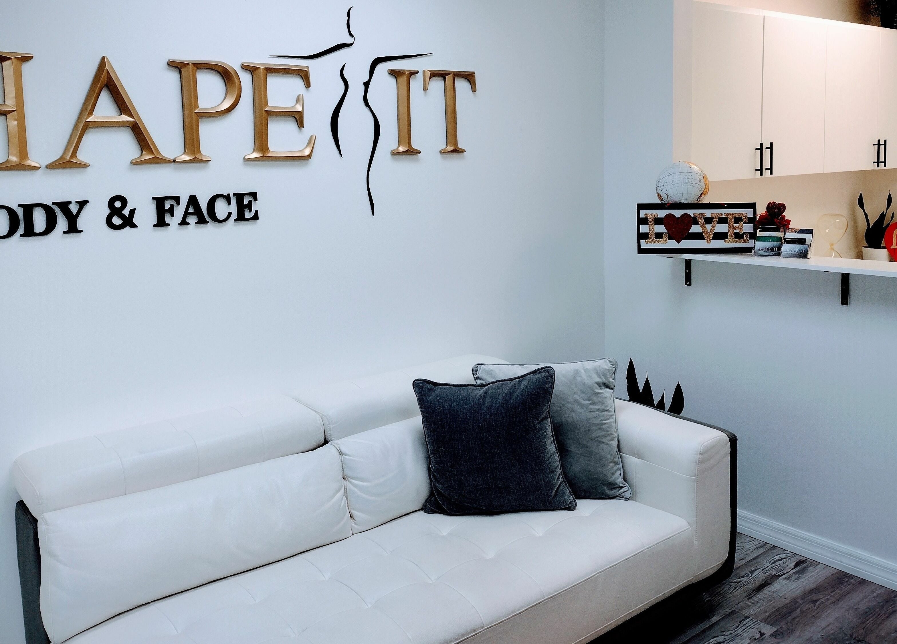 Modern lounge at Shape It Body and Face, Fort Myers, Florida, US features sleek decor and cozy seating.