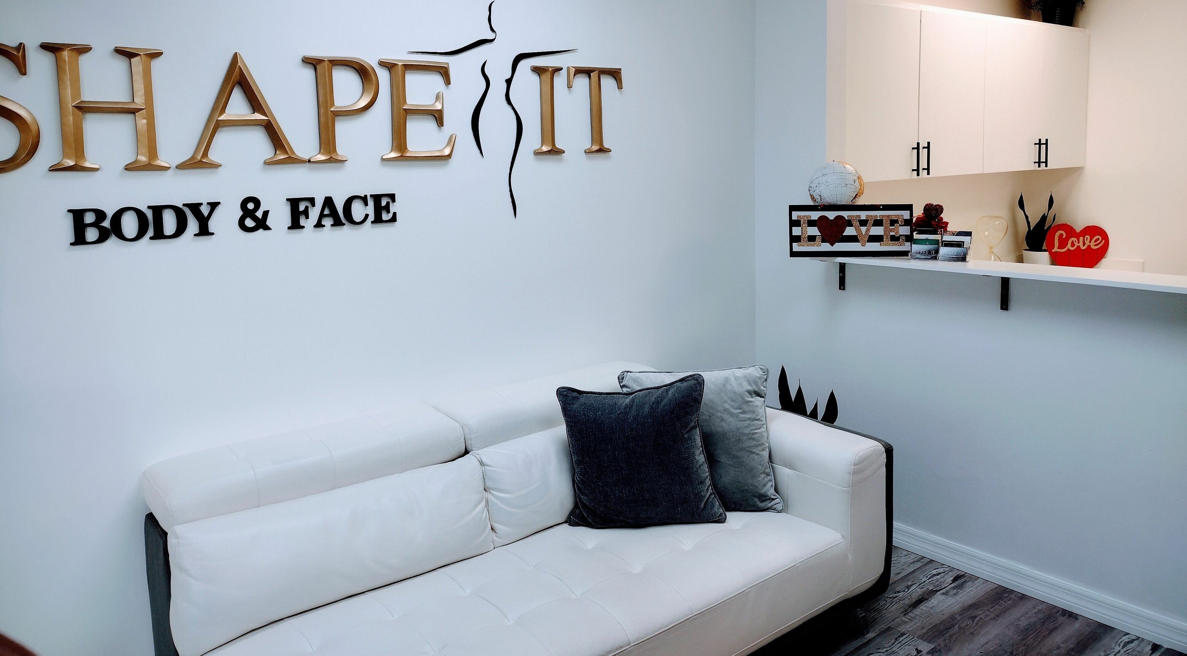 Modern lounge at Shape It Body and Face, Fort Myers, Florida, US features sleek decor and cozy seating.